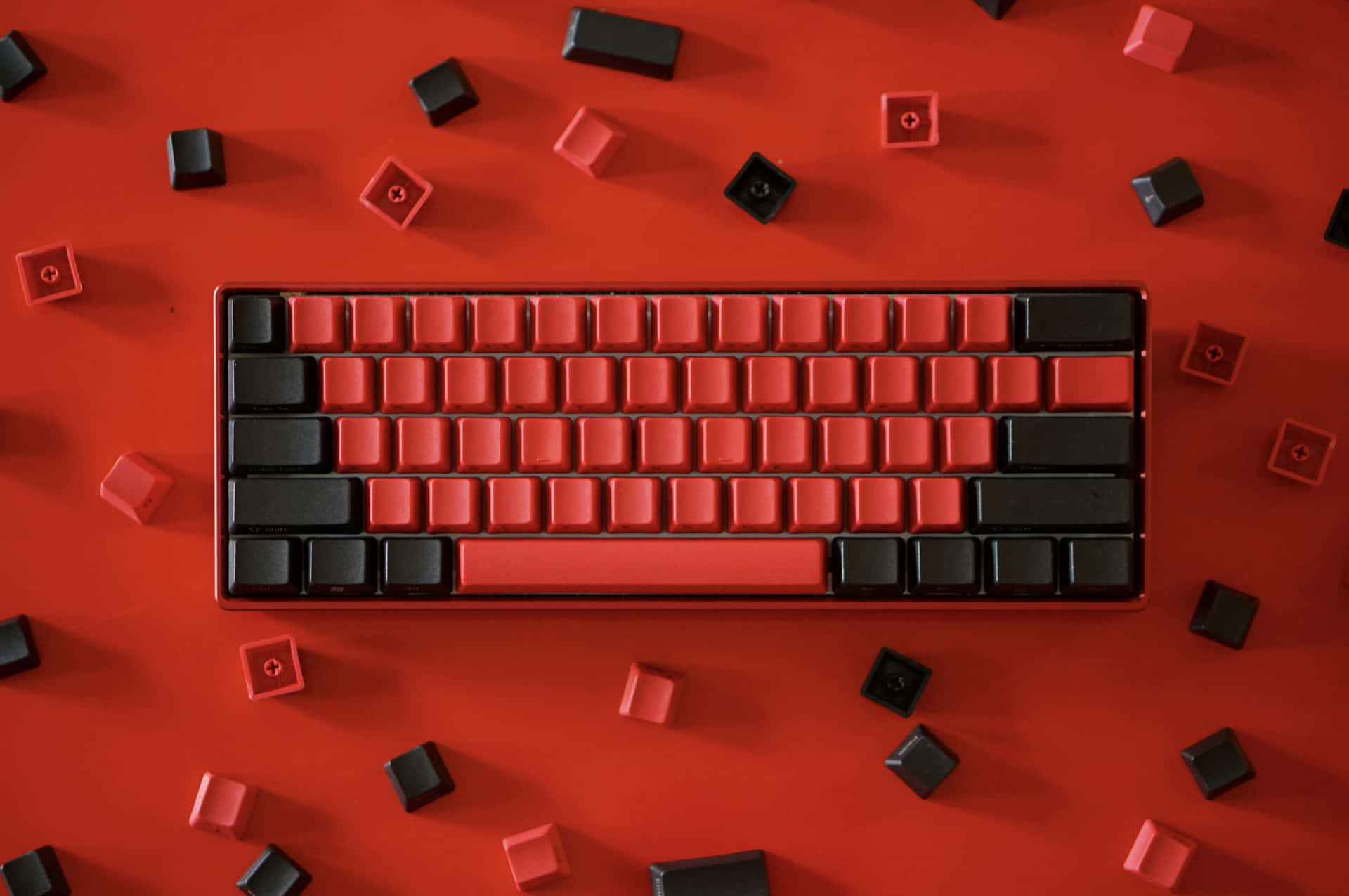 A Red And Black Keyboard With Black And Red Blocks
