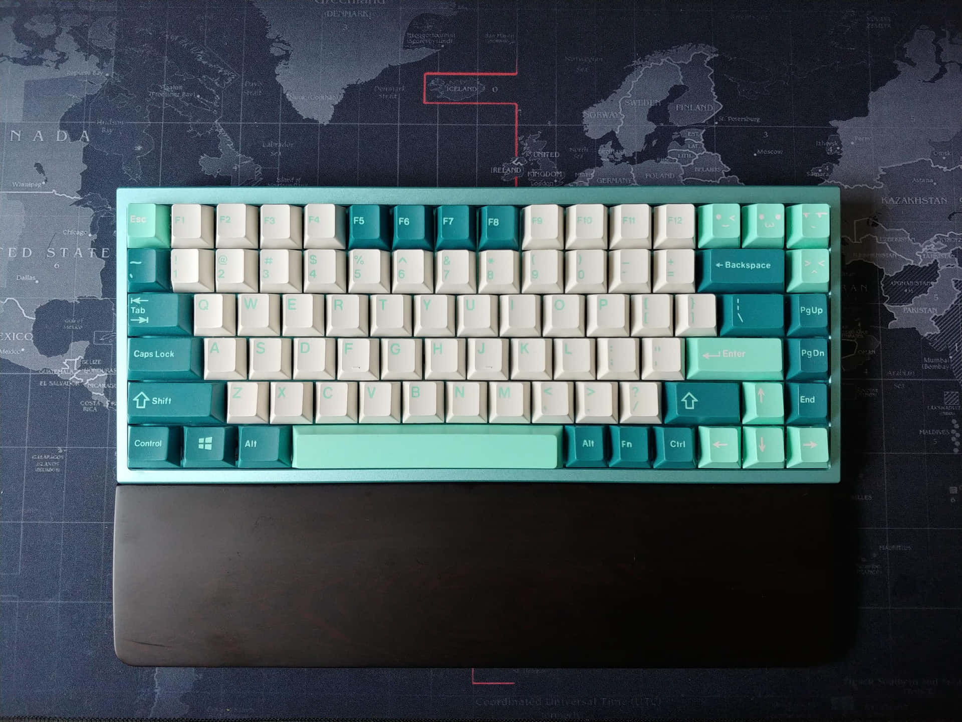 A Blue And White Keyboard With A Map On It