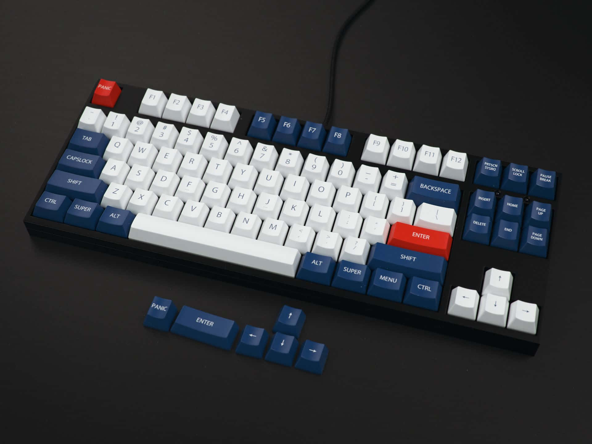 A Blue And White Keyboard With A Red And Blue Key