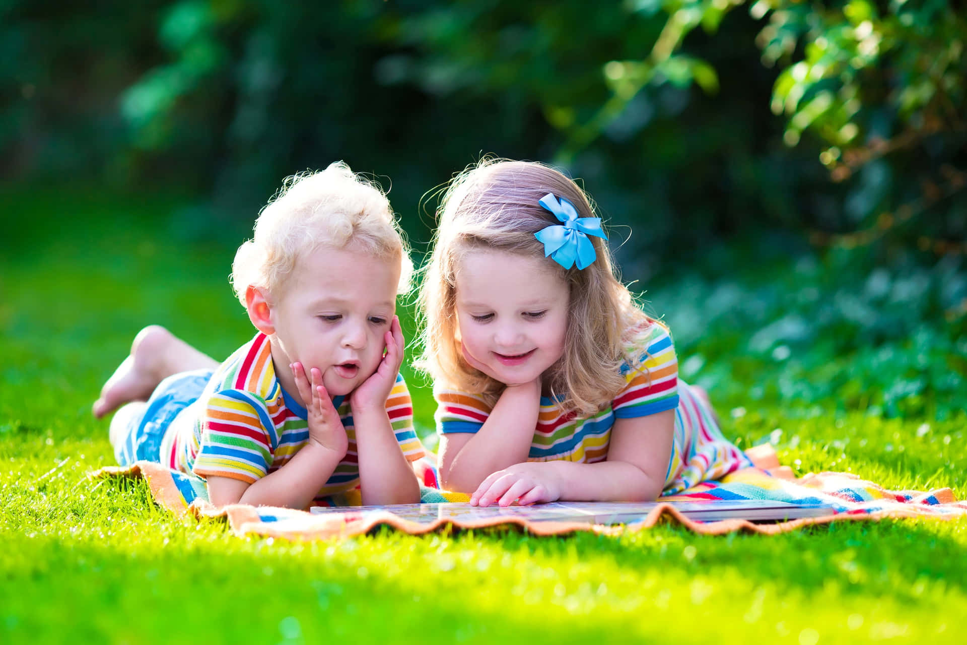 Adorable kids playing together outdoors Wallpaper