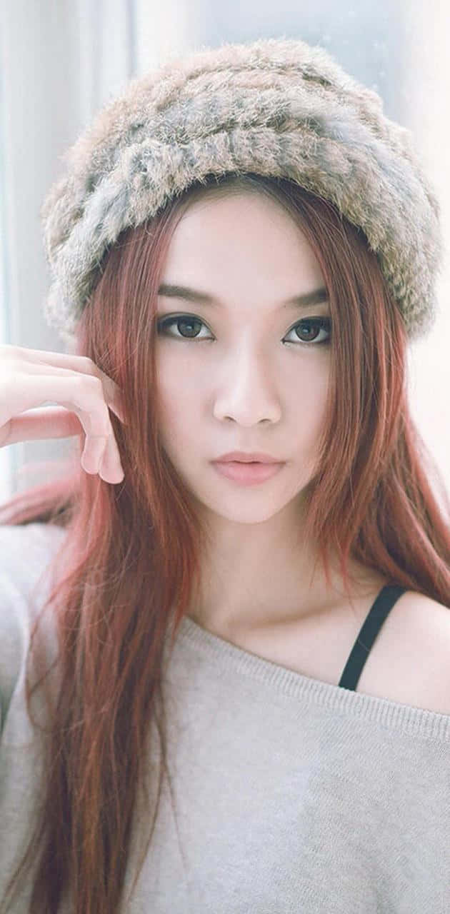 Cute Korean Girl Wearing A Beanie Wallpaper
