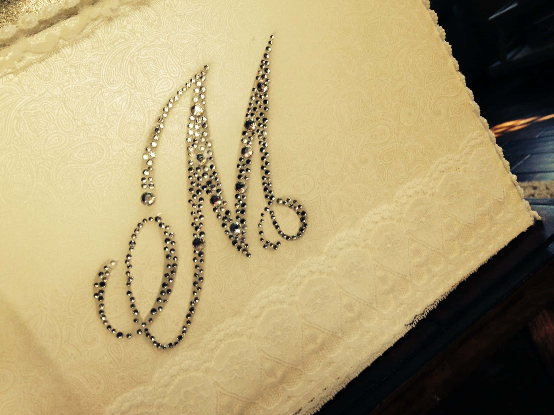 A Cake With A Monogram On It Wallpaper