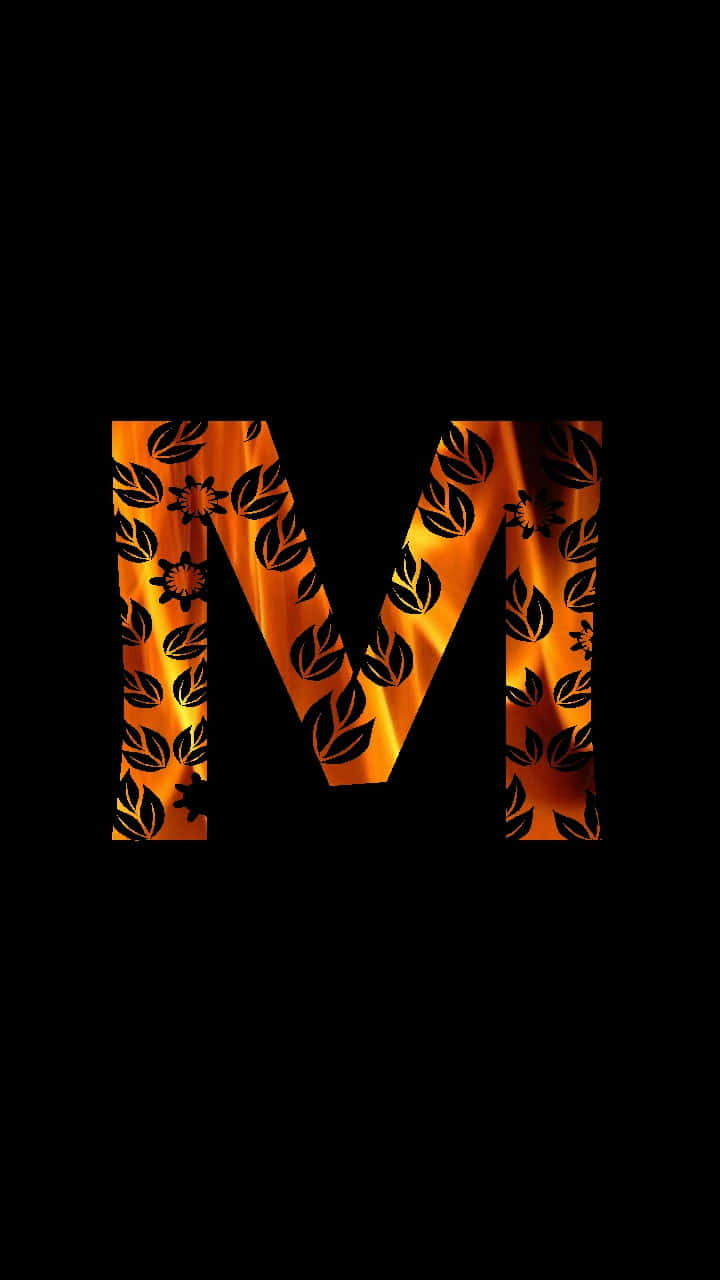 A Letter M With A Flame On It Wallpaper