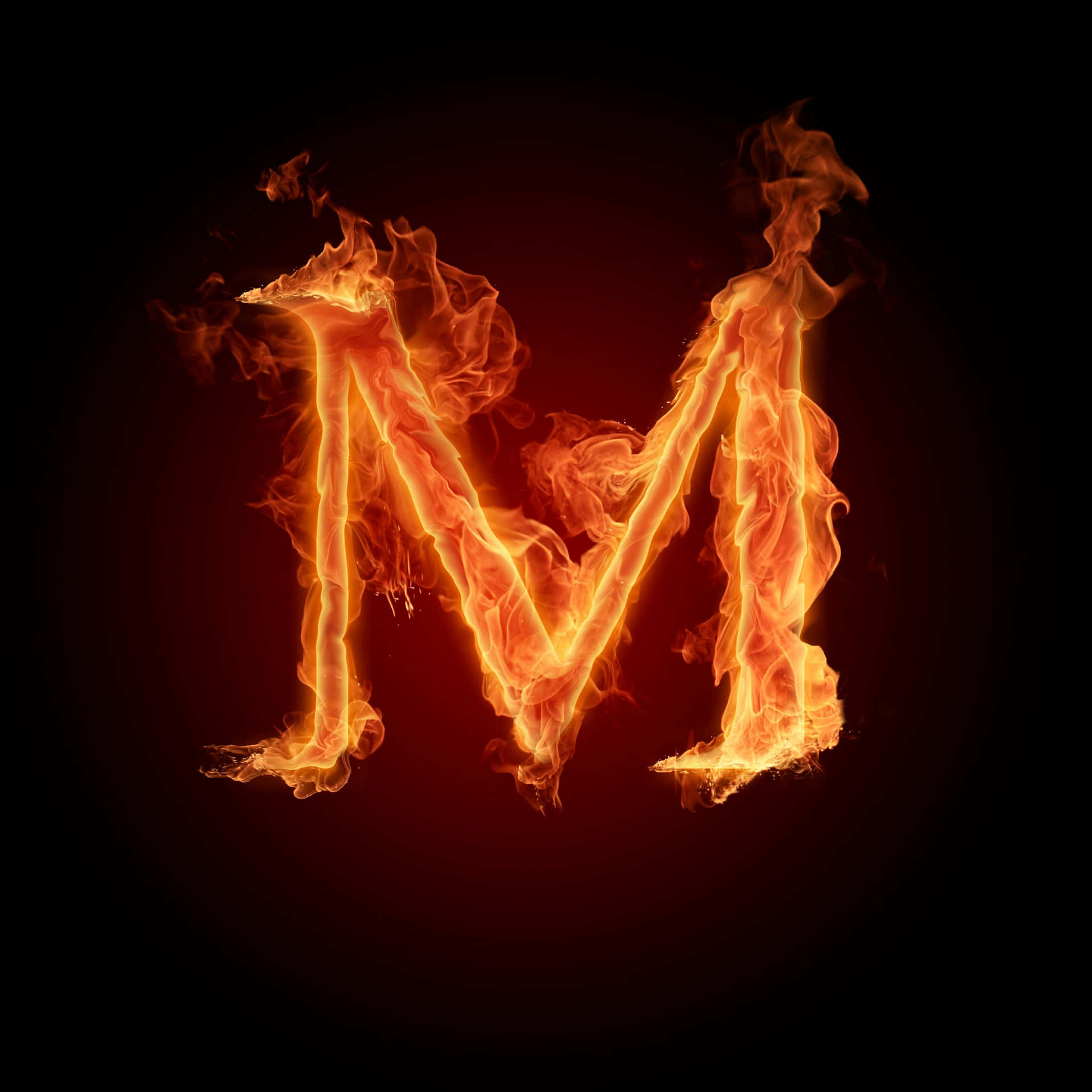 A Letter M In Fire On A Black Background Wallpaper