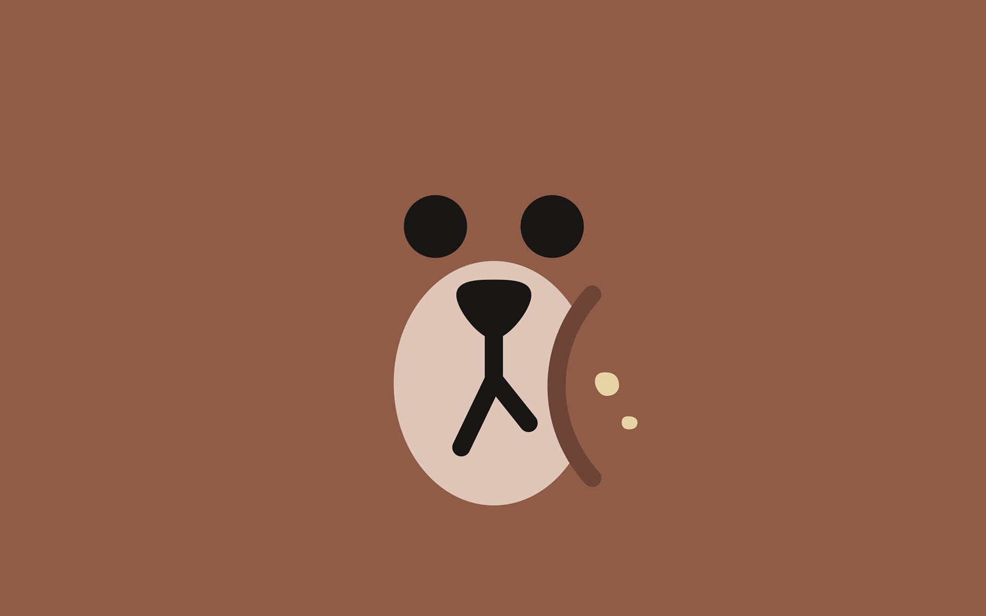 En brun bjørn med en sort næse som snorker i et felt Wallpaper