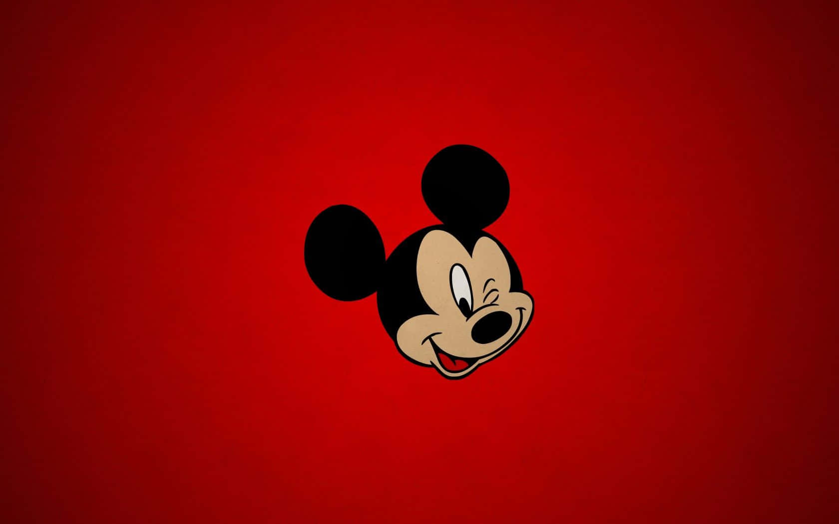 A cute Mickey Mouse cartoon shows the joyous character smiling brightly. Wallpaper
