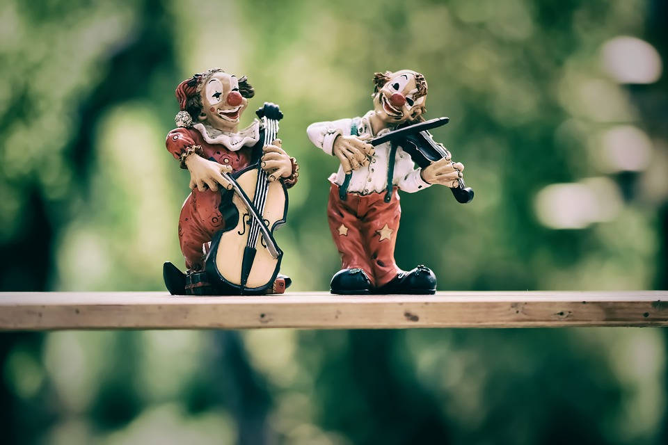 Cute Music Clowns Figurines With Instruments Wallpaper