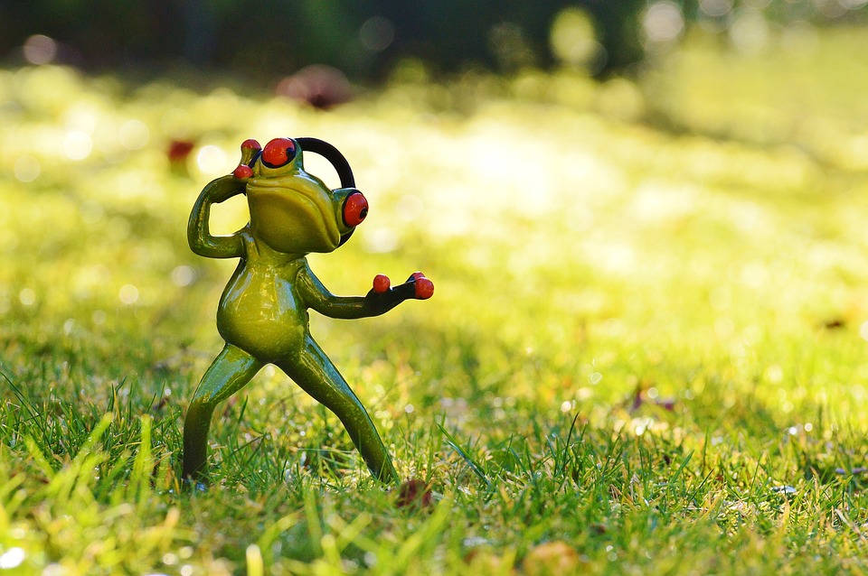 Adorably Funky Music-Loving Frog Figurine Wallpaper