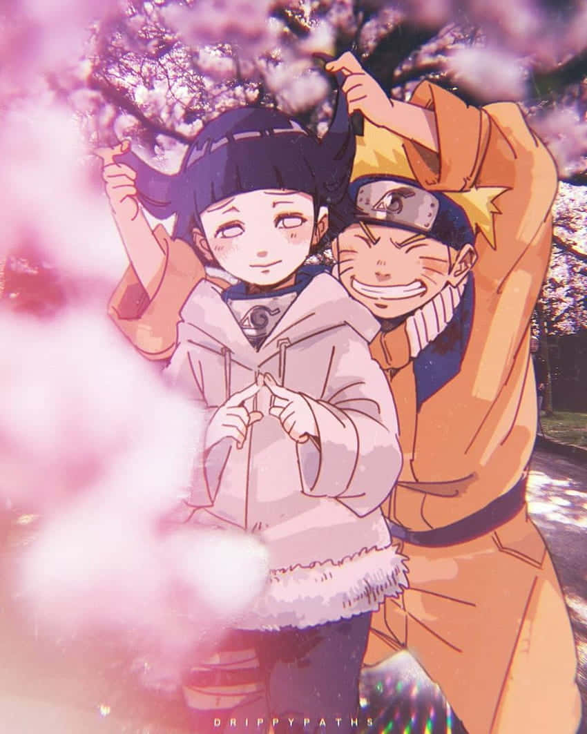 Cute Naruto And Hinata At Cherry Blossoms Park Wallpaper