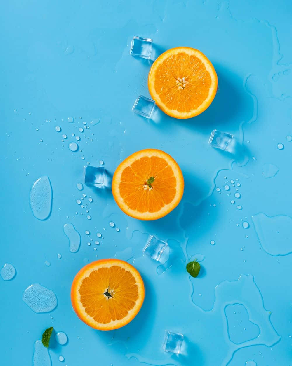 Dreiniedliche Orangenscheiben Mit Eis Wallpaper