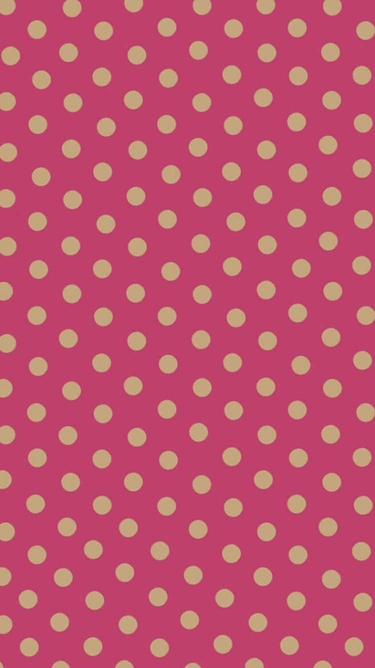 A Pink And Gold Polka Dot Pattern Wallpaper