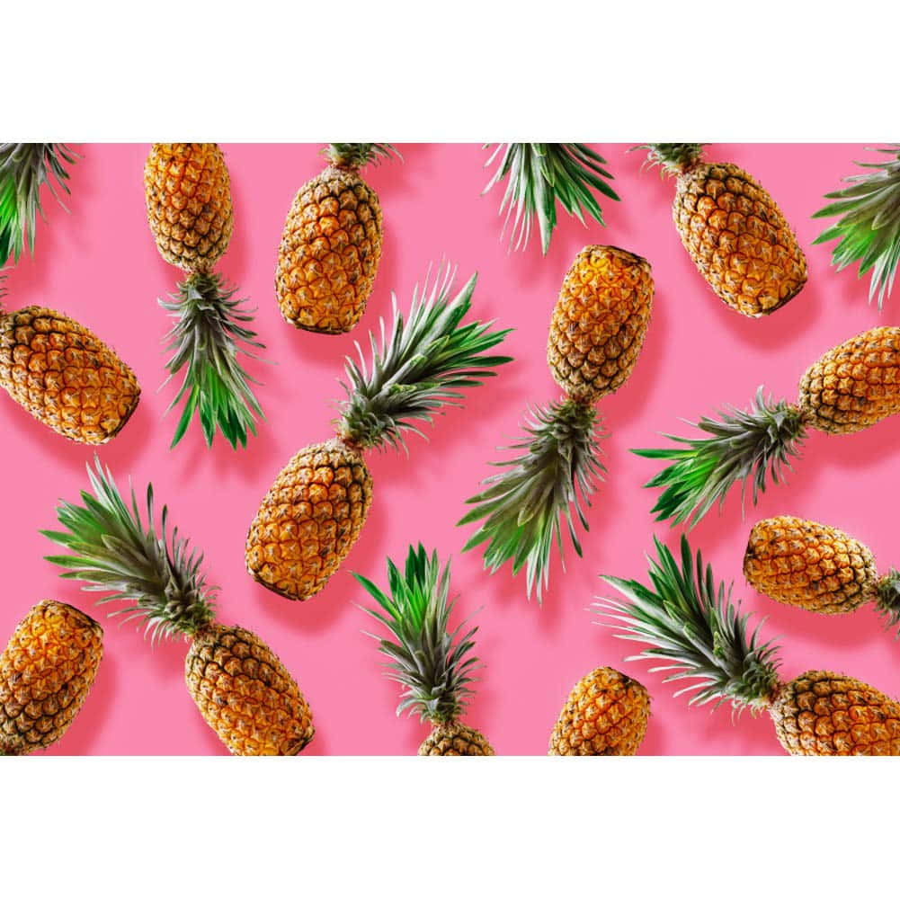 Download Cute Pineapple In Pink Background Wallpaper 