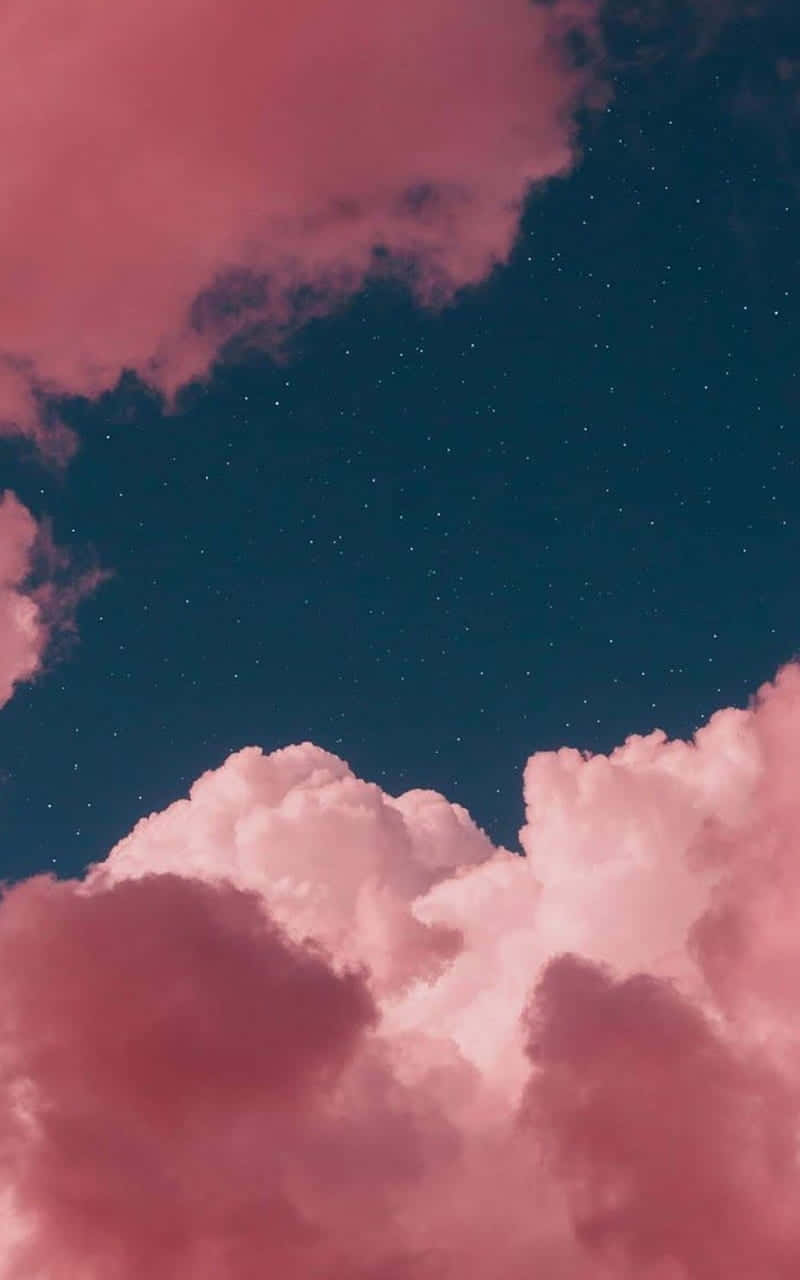 Cute Pink Clouds With A Green Sky Wallpaper