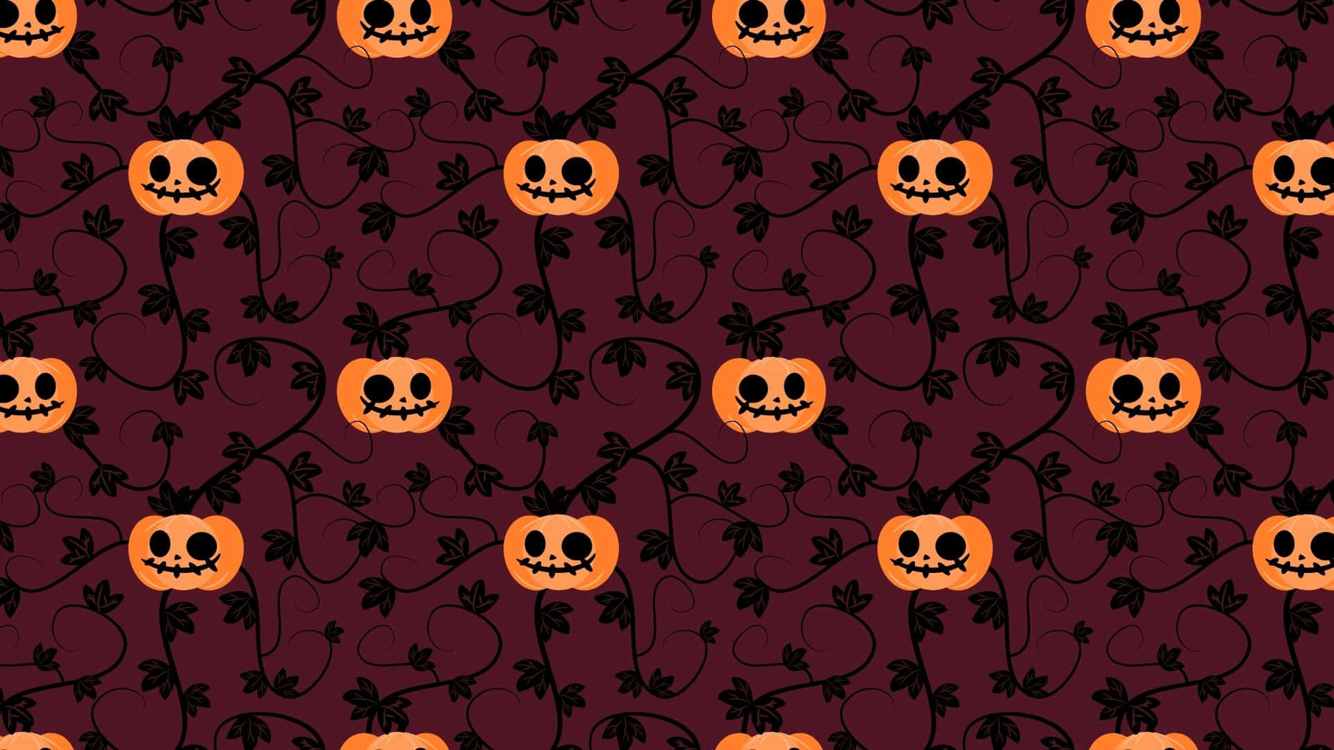 Adorable Smiling Jack-o'-Lantern in a Fall Harvest Scene Wallpaper