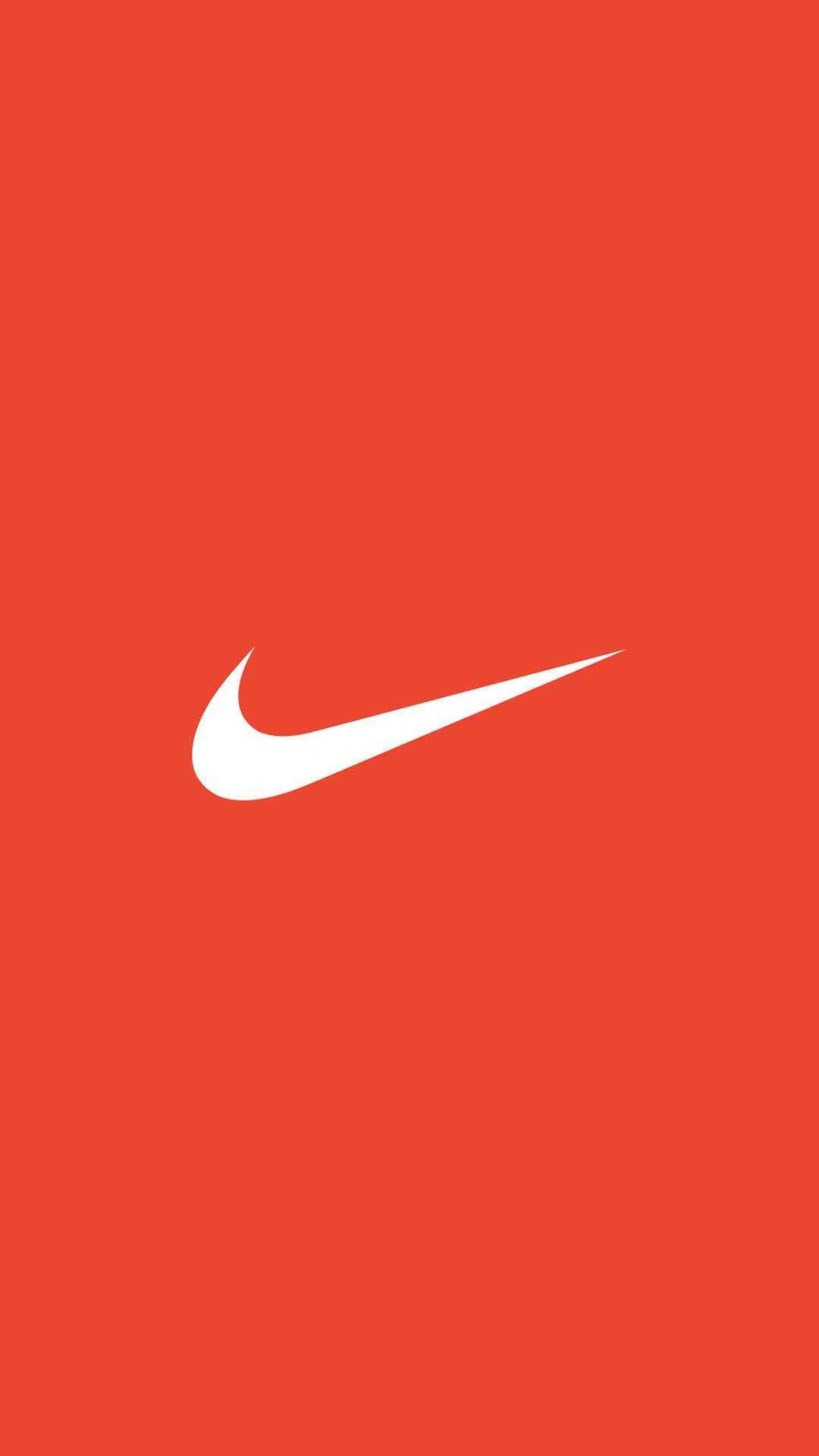Nike Logo On An Orange Background Wallpaper