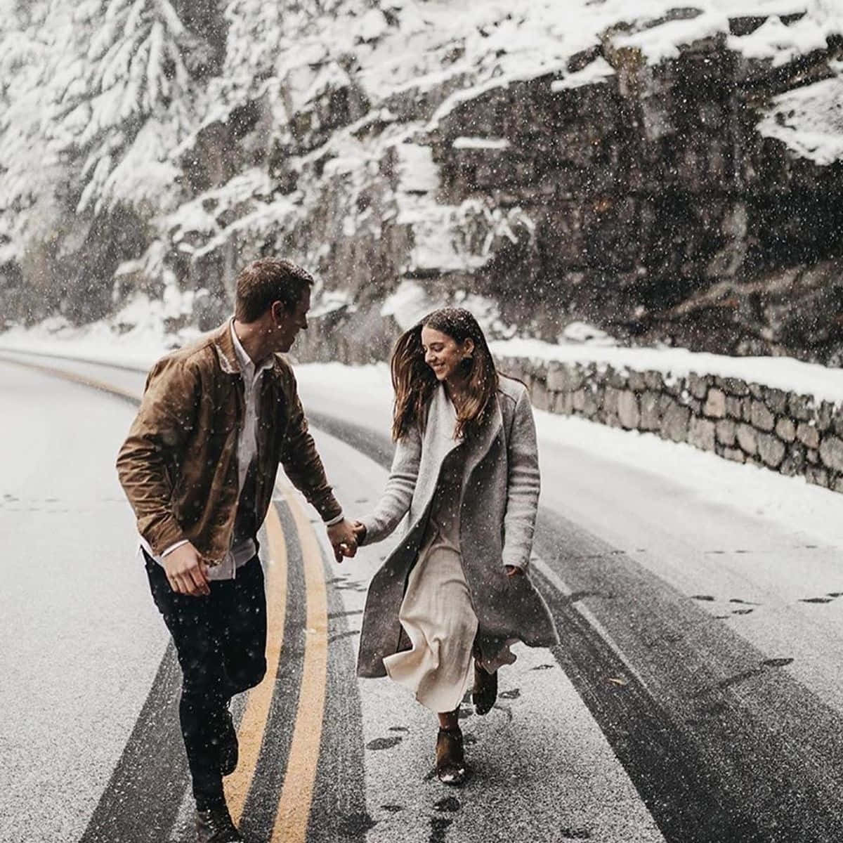 Cute Relationship Running On Snowy Road Picture