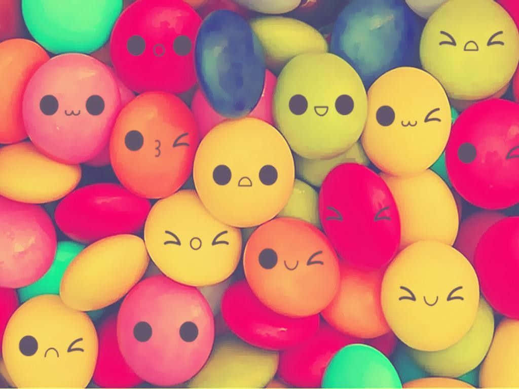 Cute Round Candies With Faces Wallpaper