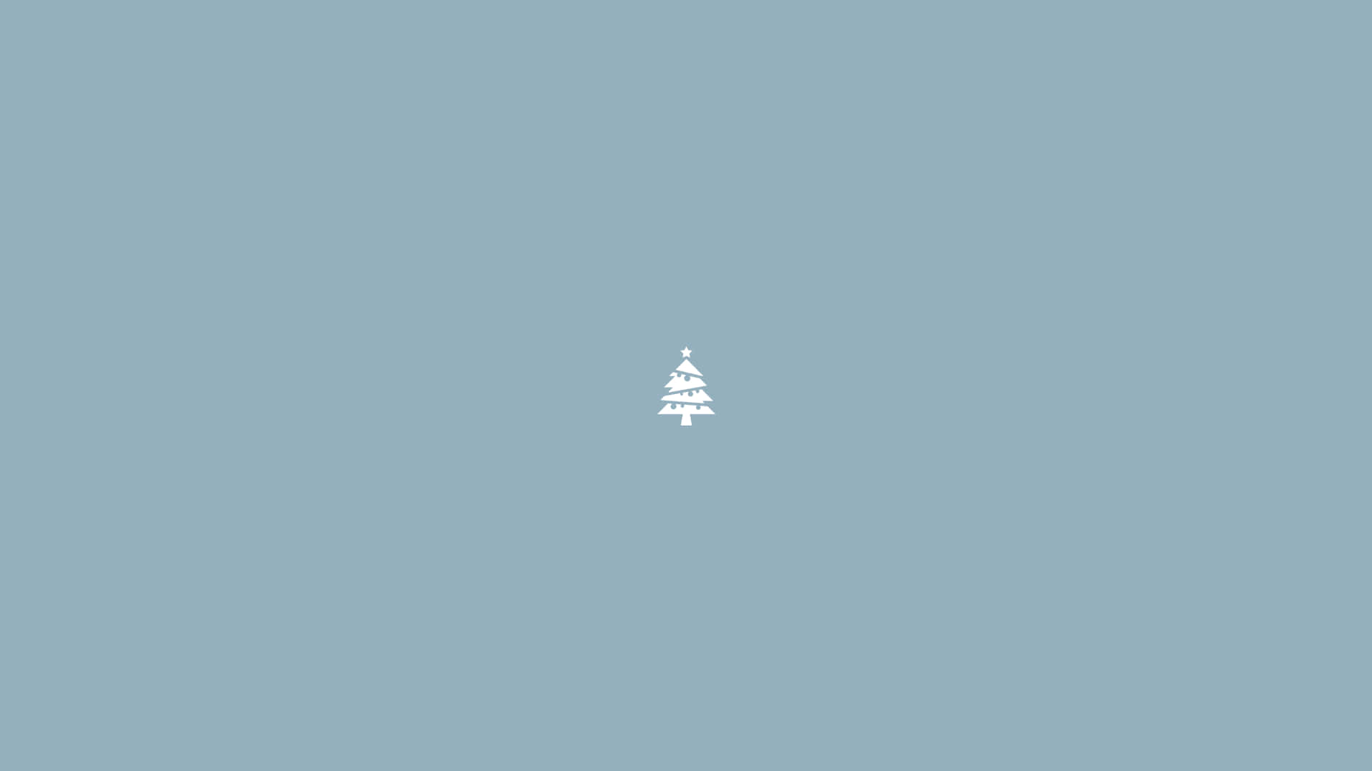 En lille jule træ på en blå baggrund Wallpaper