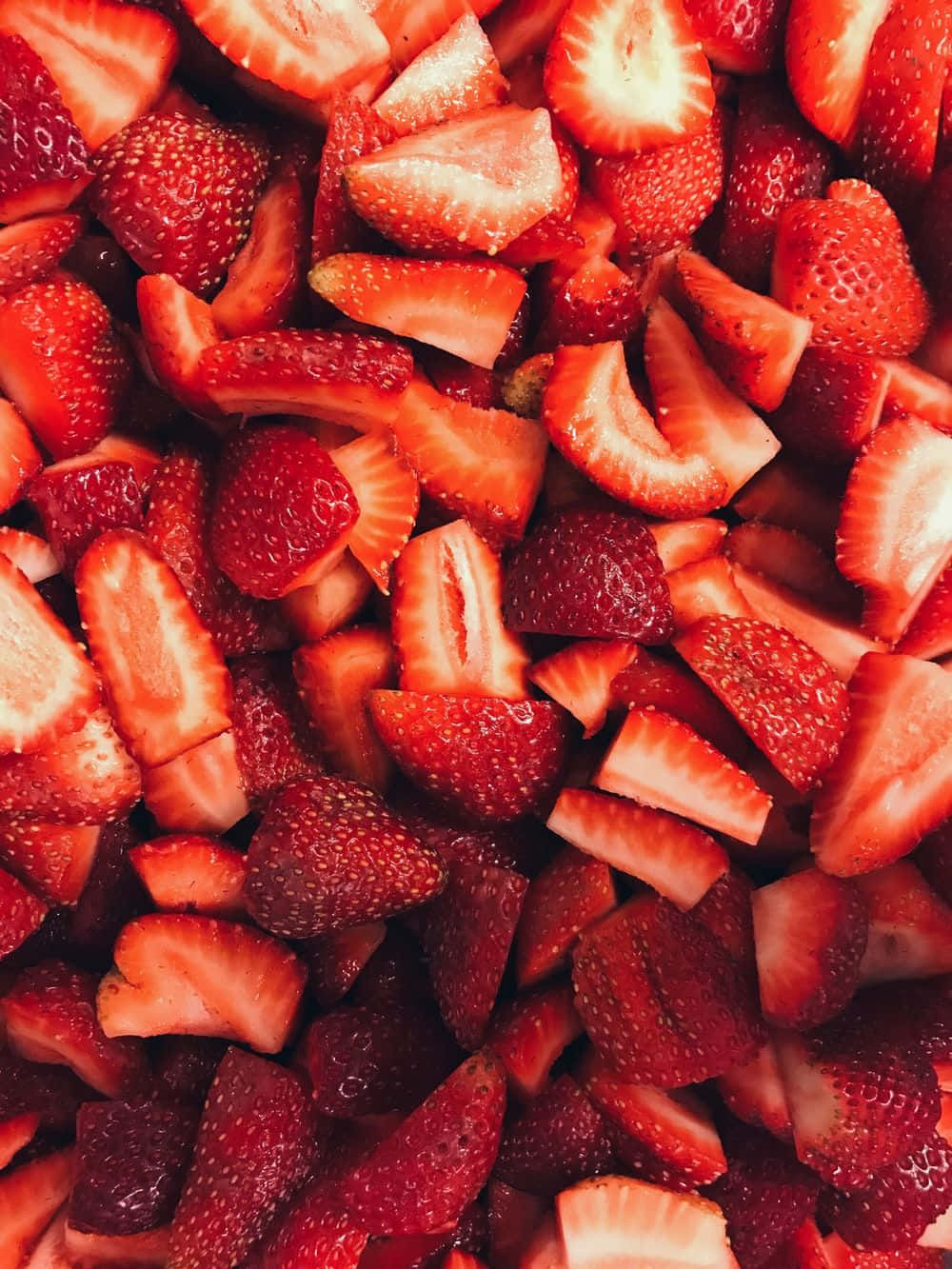 A Close Up Of Strawberries In A Bowl Wallpaper