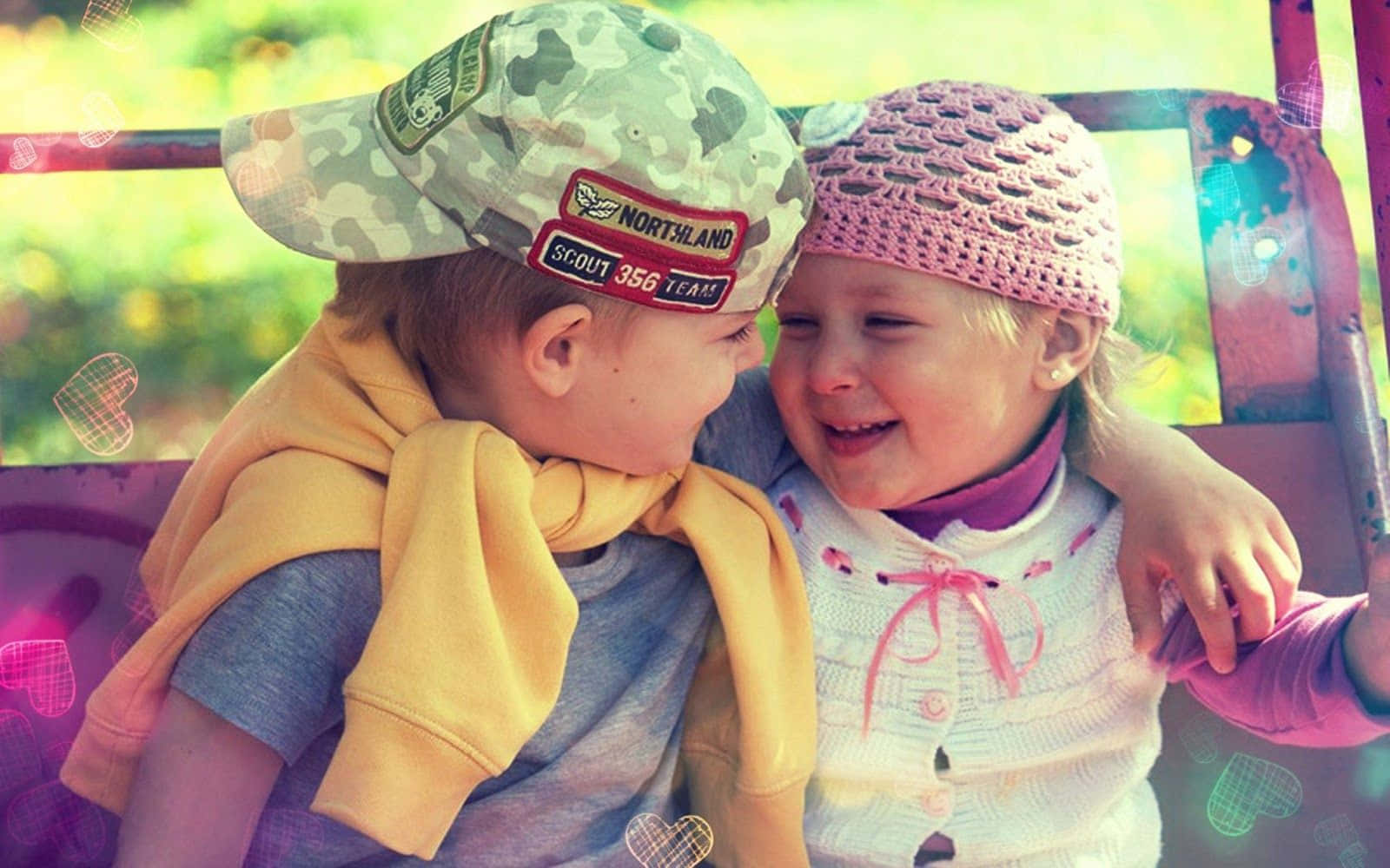 Cute Toddlers Smiling Together Wallpaper