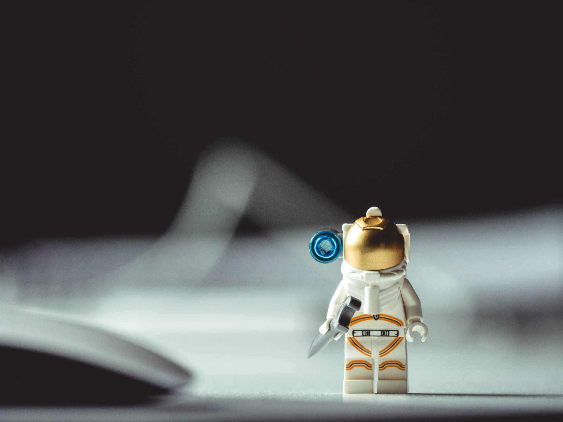 Cute Toy Astronaut In Space Wallpaper