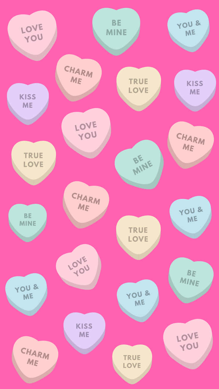 Valentine Candy Hearts On Pink Background Wallpaper