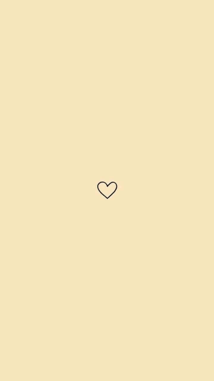A Heart Shaped Icon On A Yellow Background Wallpaper