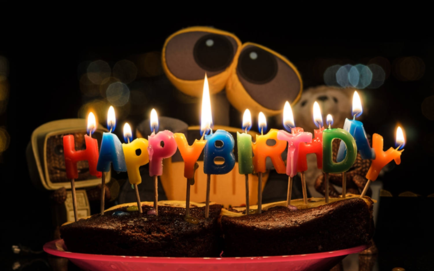 Adorable Wall-E Birthday Cake with Candles Wallpaper
