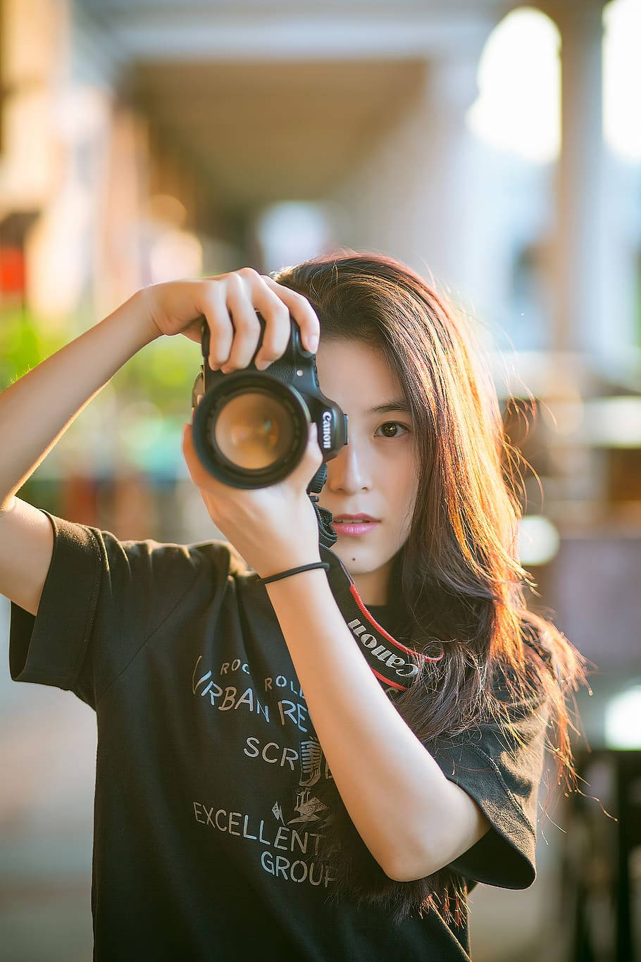 Cute Woman Holding Camera Background