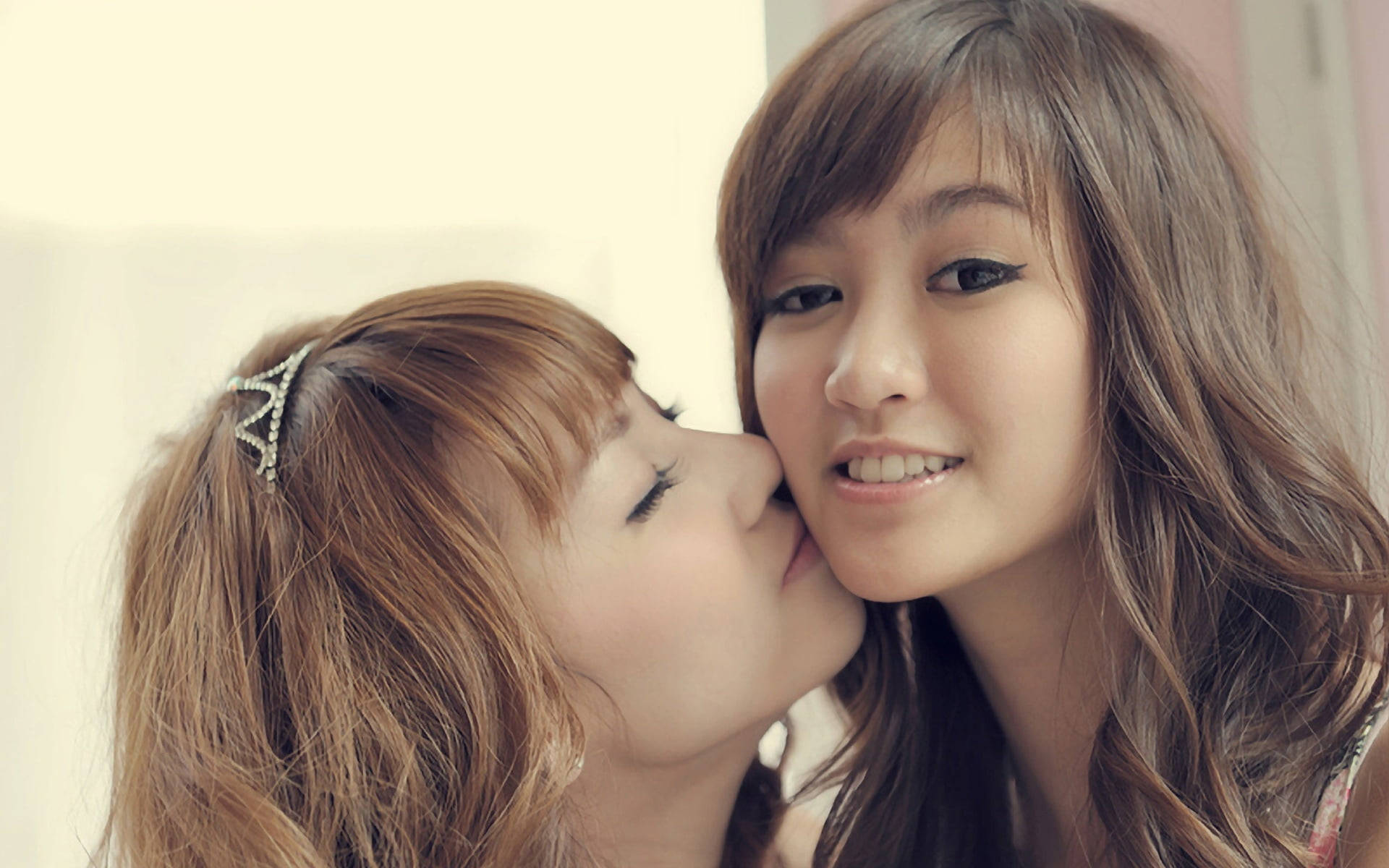 Cute Women Kissing Photo Wallpaper