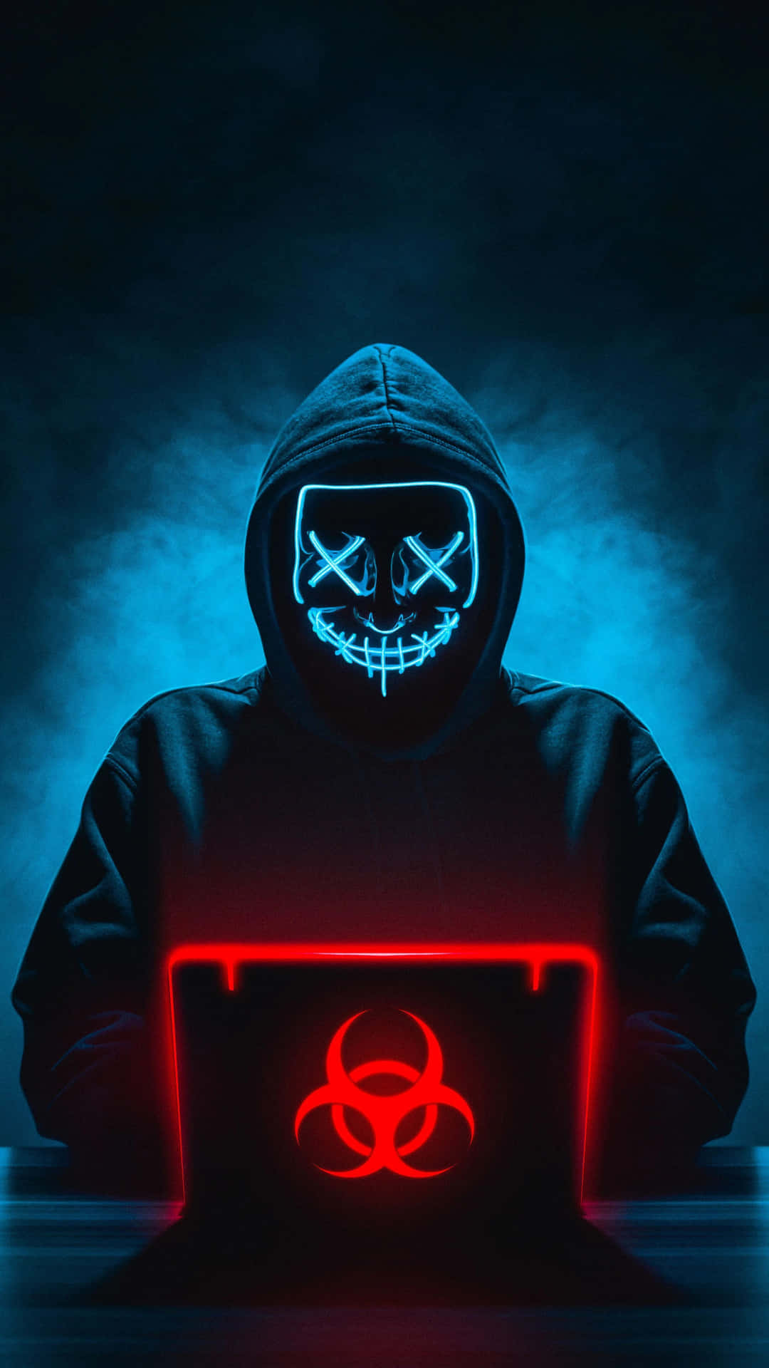 Cybersecurity_ Concept_ Hacker_with_ Glowing_ Mask_and_ Laptop Wallpaper