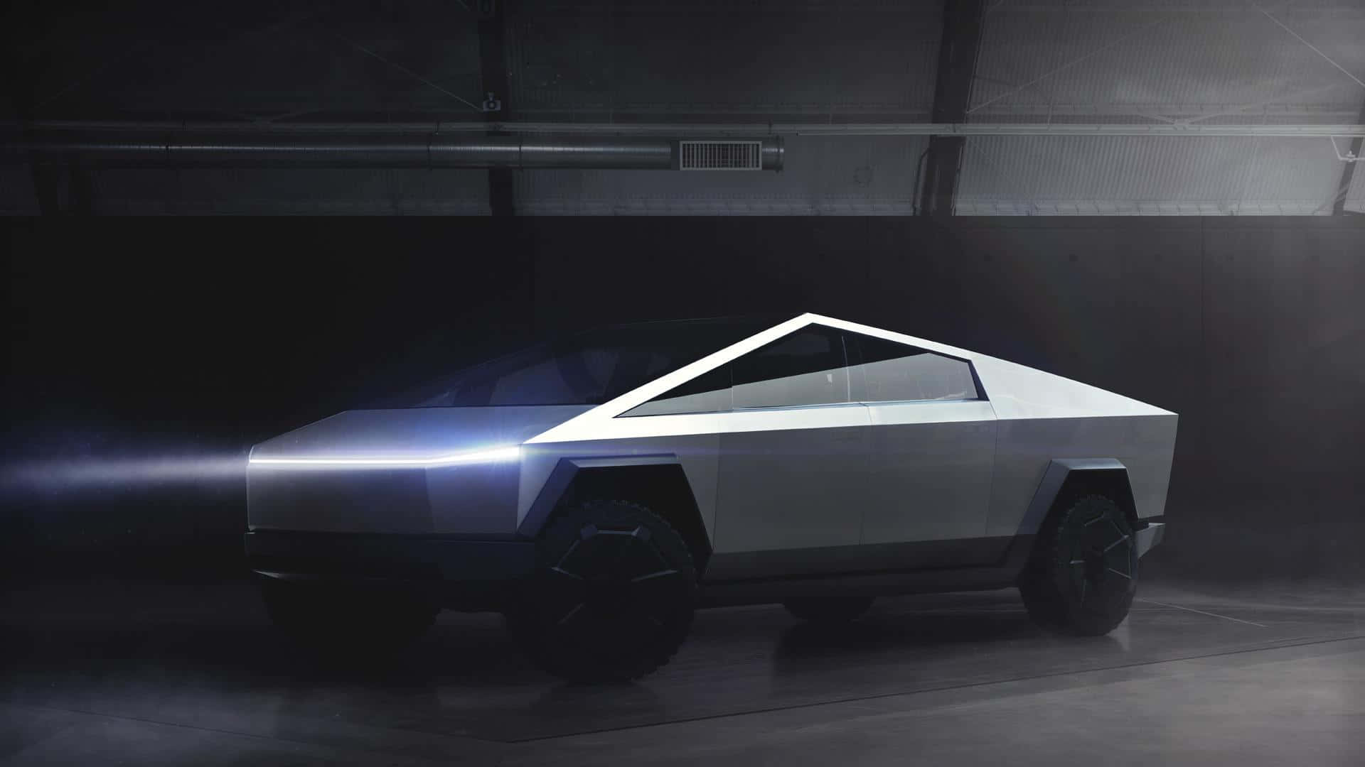 A Futuristic Vehicle Is Shown In A Dark Room