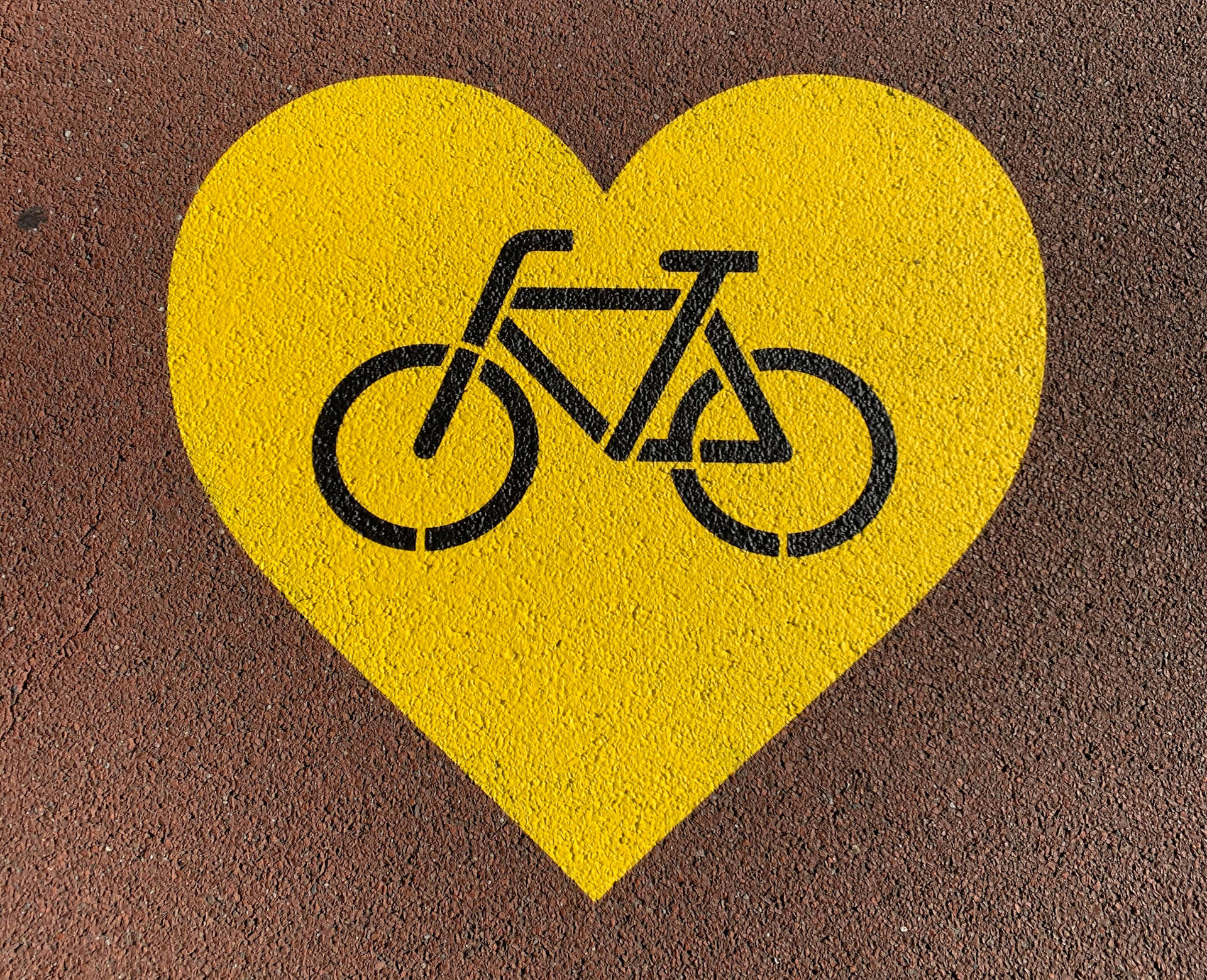 Radfahrendesgelbes Herzzeichen Wallpaper
