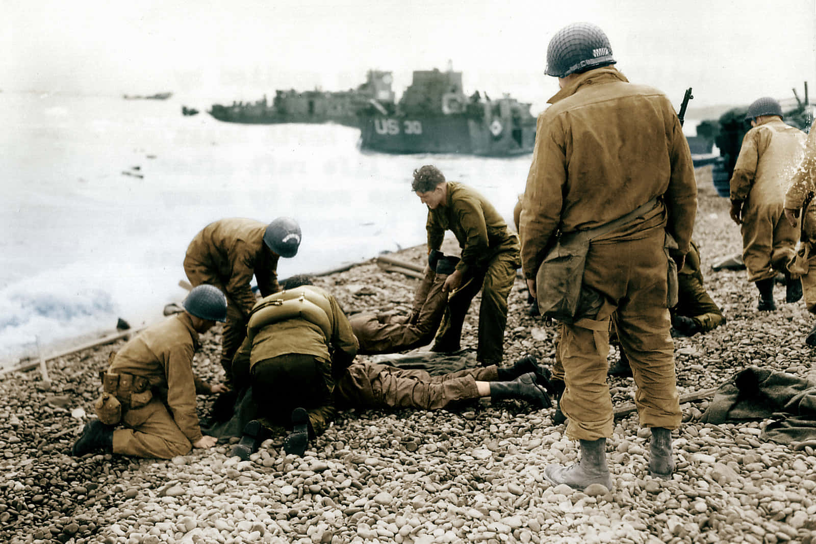 A Group Of Soldiers Are Laying On The Beach