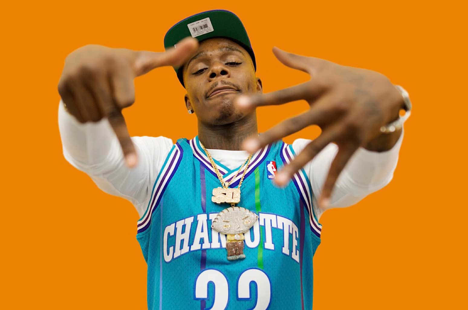DaBaby strikes a pose during an event