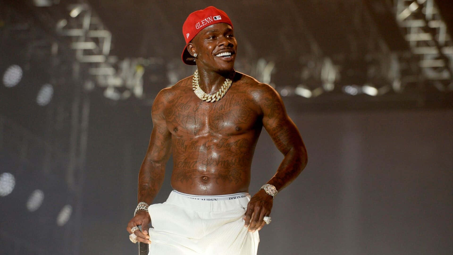 DaBaby Smiling in a Stylish Outfit