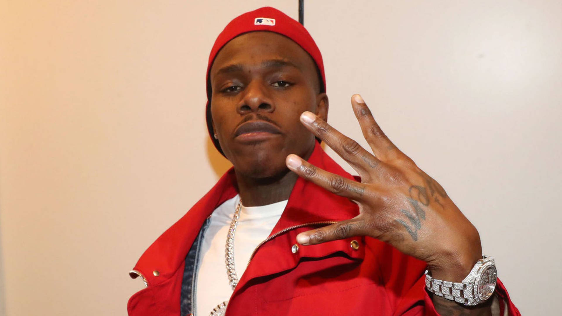 Rapper DaBaby Flashing Four Finger Hand-Sign Wallpaper