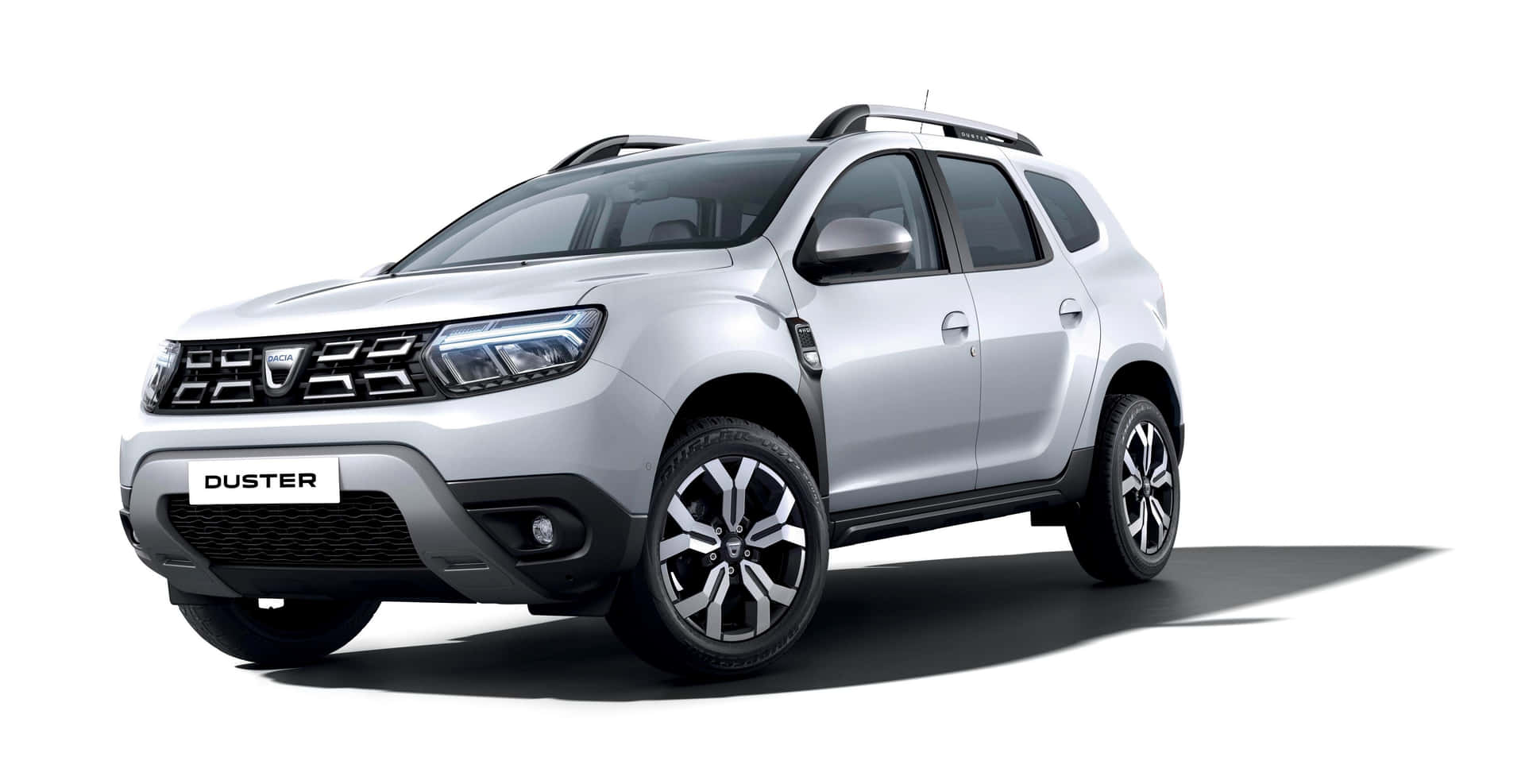 Stunning Dacia vehicle showcased with a picturesque mountain backdrop Wallpaper