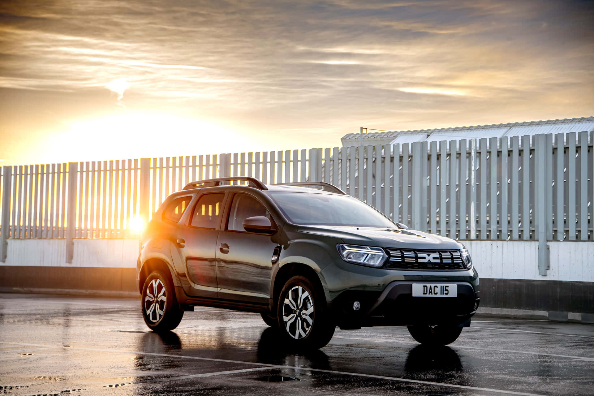 Download Dacia Duster Sunset Glow Wallpaper | Wallpapers.com