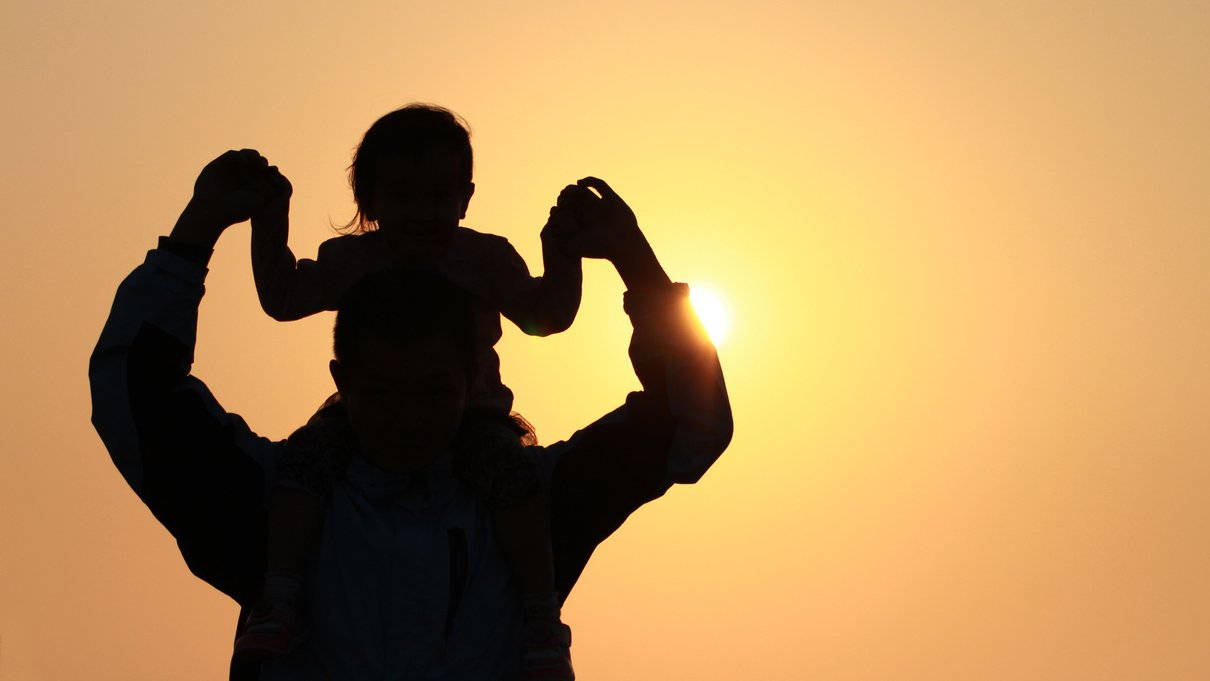Download Dad And Baby Watching Sunset Wallpaper 