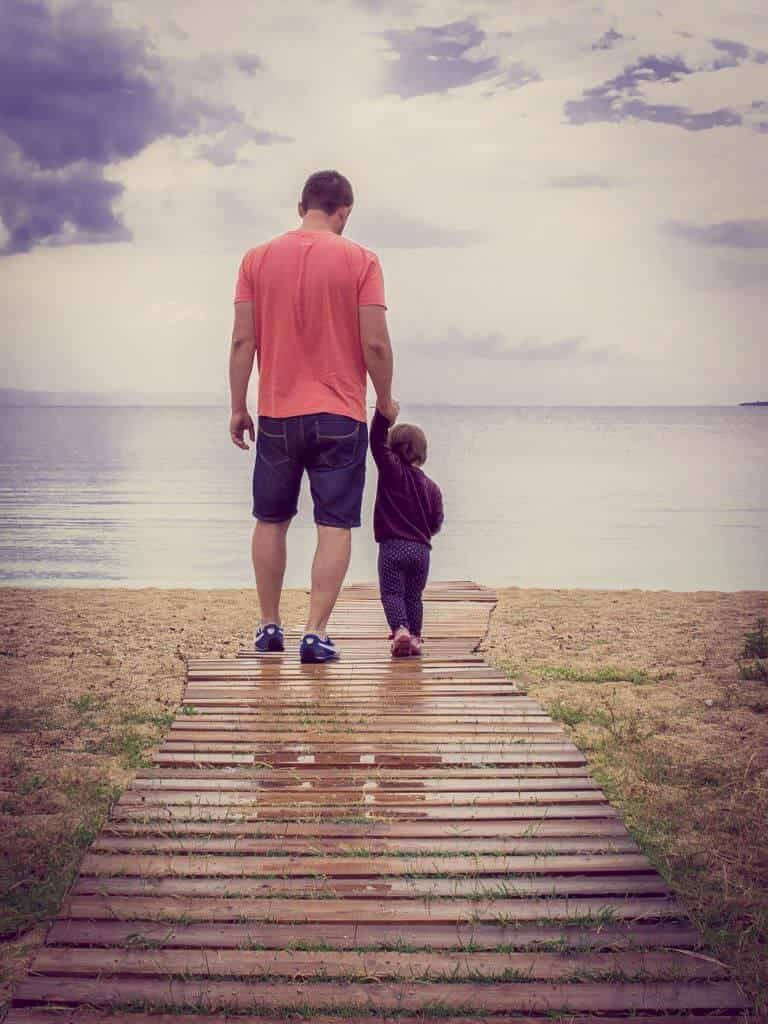Dad And Child Strolling Wallpaper
