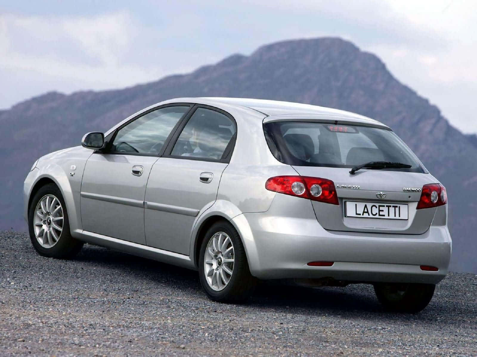 Classic Daewoo Car in a Scenic Setting Wallpaper