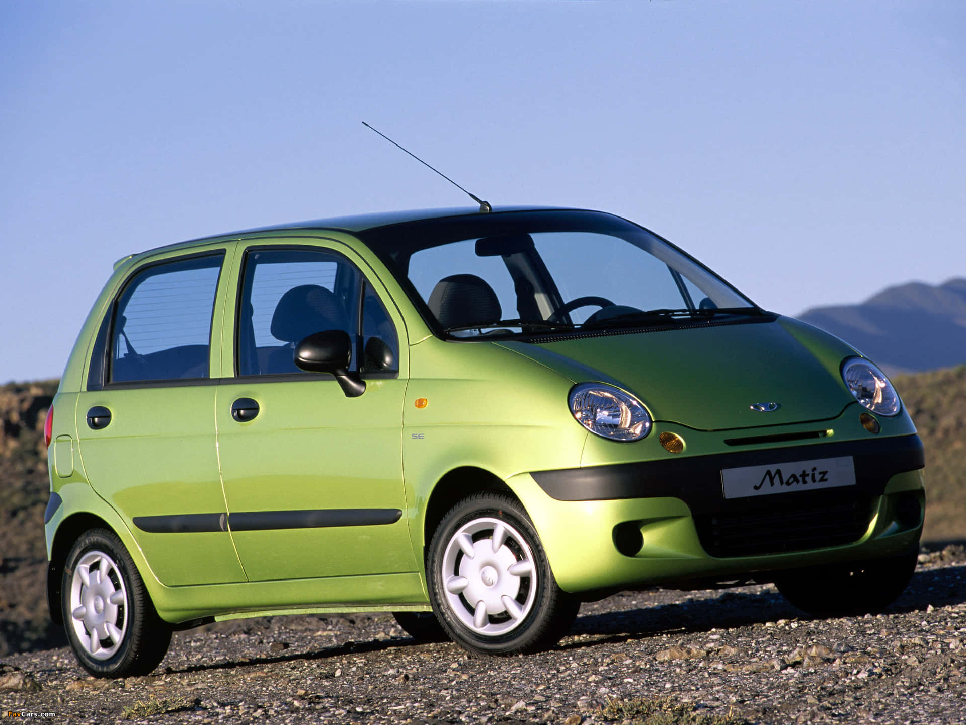 Sleek Daewoo Car on Open Road Wallpaper