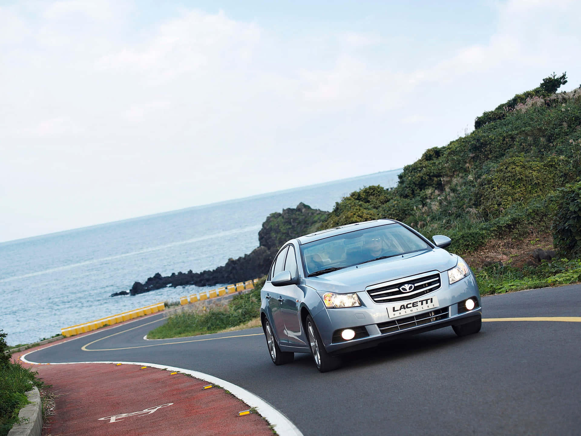 Daewoo Lacetti In Sleek Silver Gliding On The Highway. Wallpaper