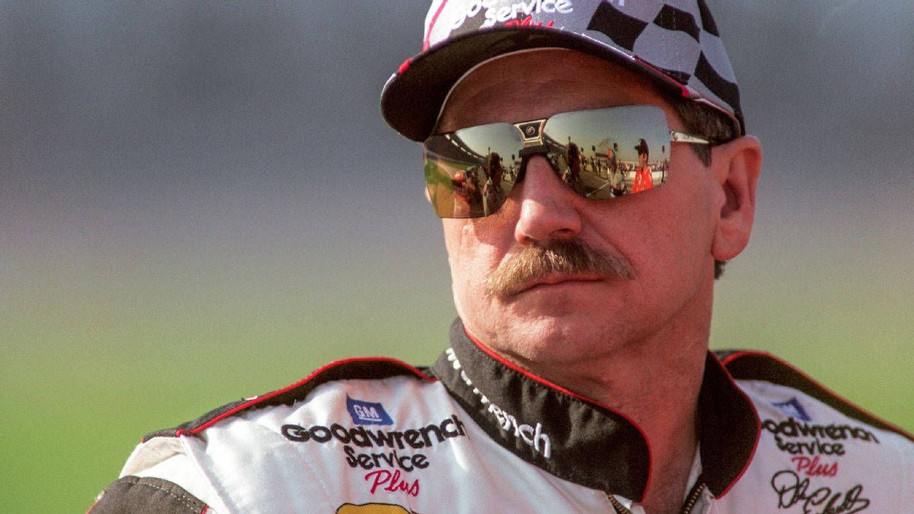 A Man In A Nascar Uniform With Sunglasses Wallpaper