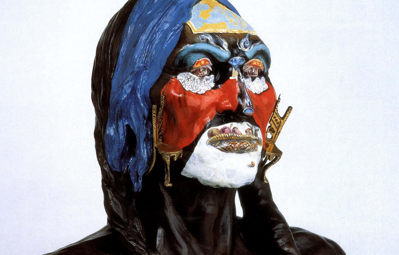 A Sculpture Of A Man With A Blue And Red Face Wallpaper
