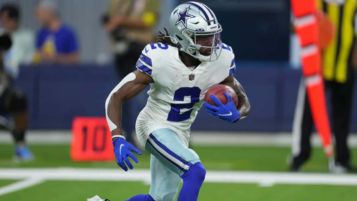 Dallas Cowboys Player Running With Football Wallpaper