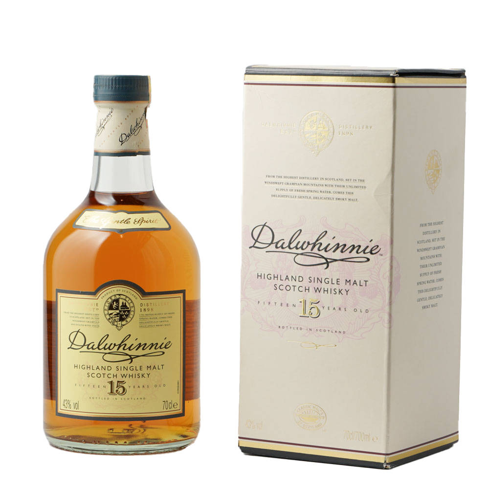 Botellade Whisky Dalwhinnie 15 Con Caja Mirando Hacia La Izquierda. Fondo de pantalla