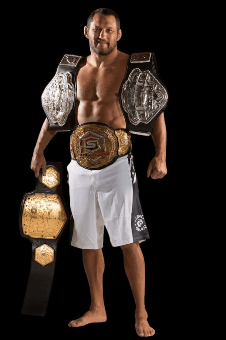 Caption: Champion Dan Henderson Flaunting His Championship Belts Wallpaper