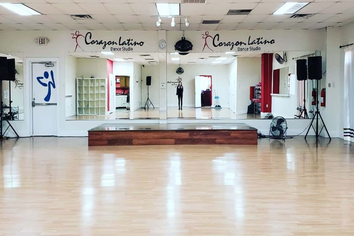 A Dance Studio With A Mirror And A Dance Floor